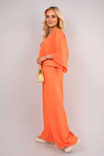 Load image into Gallery viewer, V-Neck Wide Sleeve Jumpsuit with Ring Front Detail
