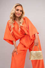 Load image into Gallery viewer, V-Neck Wide Sleeve Jumpsuit with Ring Front Detail
