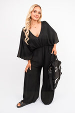 Load image into Gallery viewer, Wide Leg V Neck Jumpsuit with Back Tie Detail

