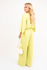 Load image into Gallery viewer, Wide Leg V Neck Jumpsuit with Back Tie Detail
